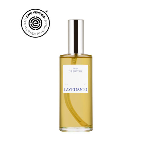 Picture of the body oil in the scent, Amal, with the Ewg-verified logo